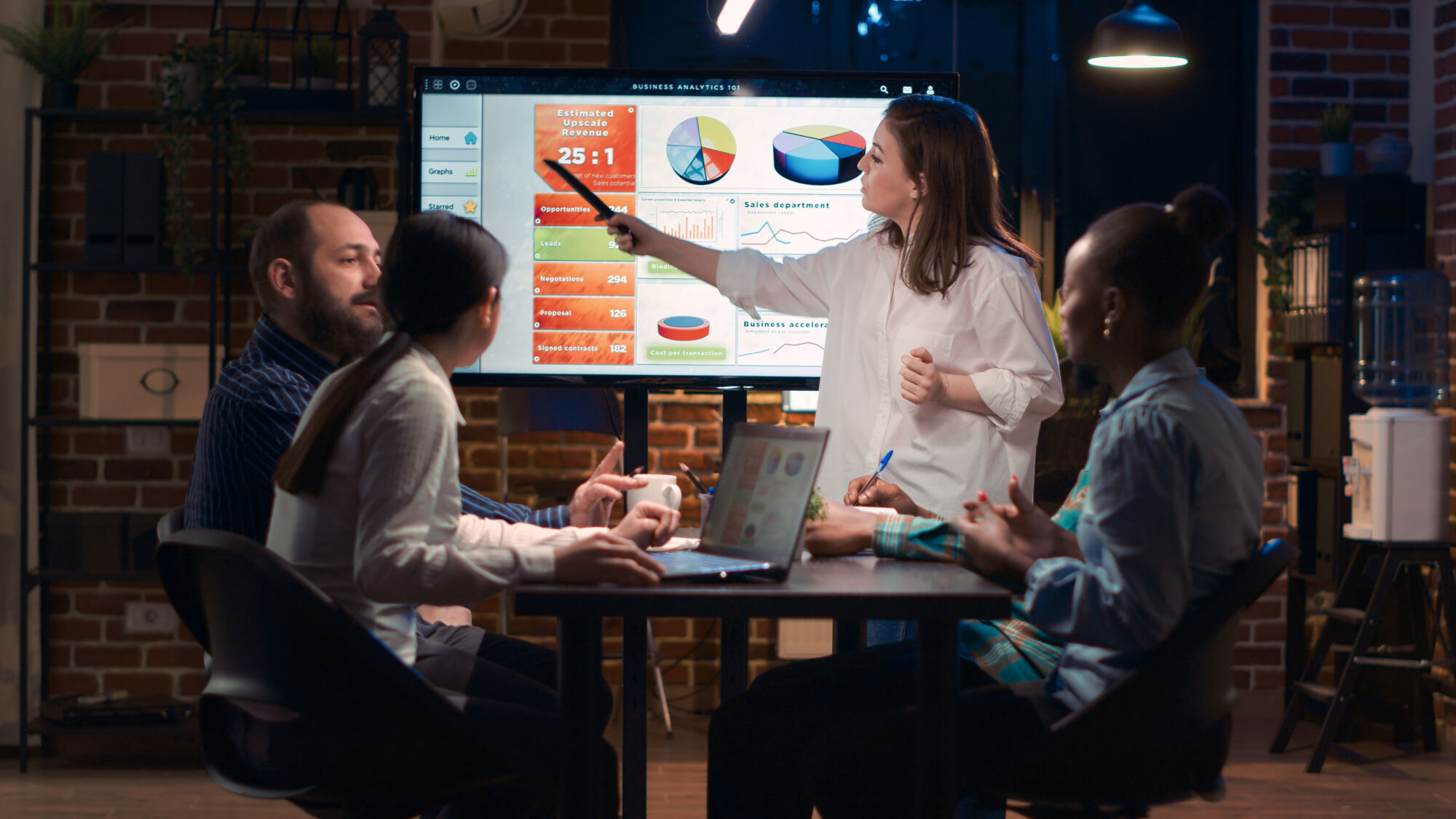 Company employee explaining analytics research results in business meeting